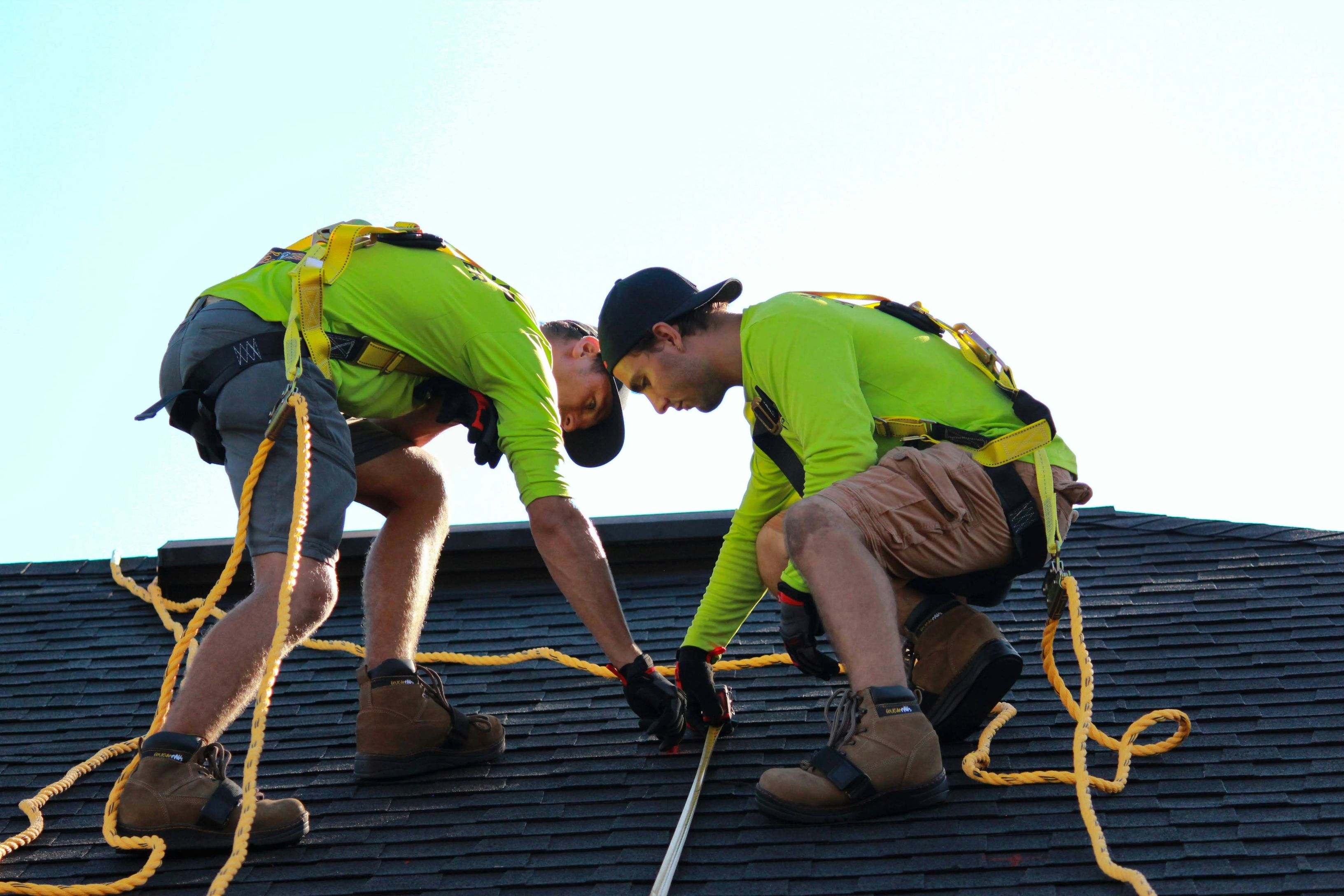 Two workers on a roof